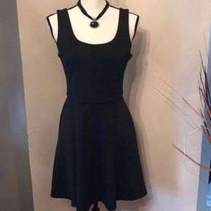 Black sleeveless dress.